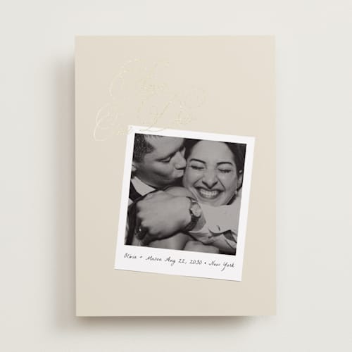This is a linen foil stamped save the date cards with foil pressed by Lori Wemple called polaroid script printing on recycled smooth signature in standard