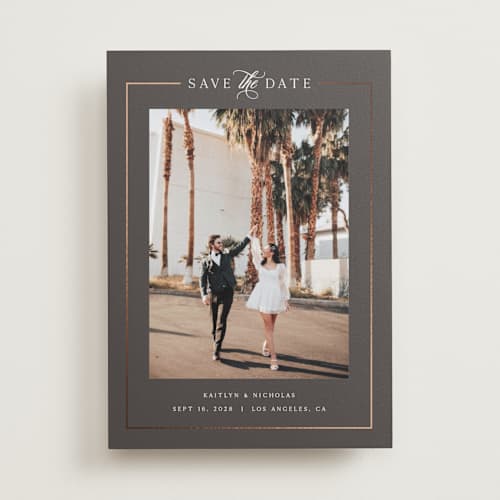 This is a graphite foil stamped save the date cards with foil pressed by Melanie Kosuge called mulholland printing on recycled smooth signature in standard