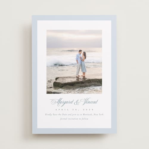This is a dusty blue save the date with standard by Jennifer Postorino called coastal charm printing on recycled smooth signature in standard