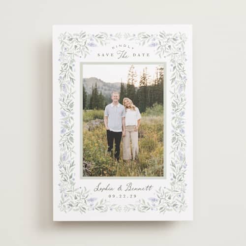 This is a periwinkle save the date with standard by Kristen Smith called delicate vines printing on recycled smooth signature in standard