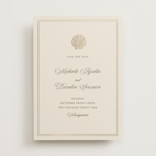 This is a champagne foil stamped save the date cards with foil pressed by Griffinbell Paper Co. called seaside printing on signature in standard
