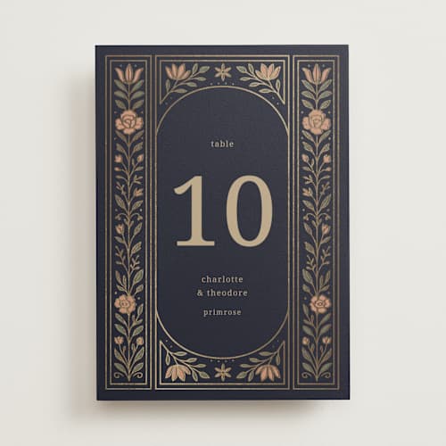 This is a navy table numbers with foil pressed by Jess Rosa Beck called botanical tapestry printing on doublethick in standard