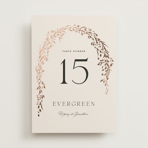 This is a almond table numbers with foil pressed by Erin L. Wilson called trailing vines printing on doublethick in standard