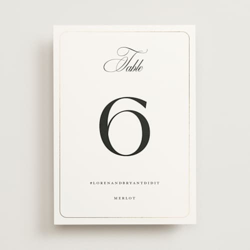 This is a cotton table numbers with foil pressed by Christie Garcia called loren printing on doublethick in standard