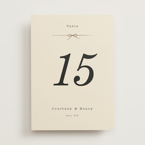 This is a ivory table numbers with foil pressed by Baumbirdy called bow tie printing on doublethick in standard