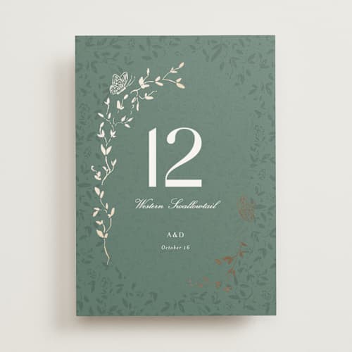 This is a eucalyptus table numbers with foil pressed by Simona Camp called southern romance printing on doublethick in standard