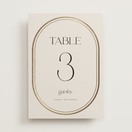 This is a sandstone table numbers with foil pressed by Lori Wemple called oval printing on doublethick in standard