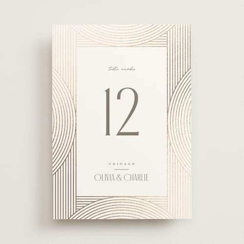 This is a alabaster table numbers with foil pressed by Pixel and Hank called moderne printing on doublethick in standard