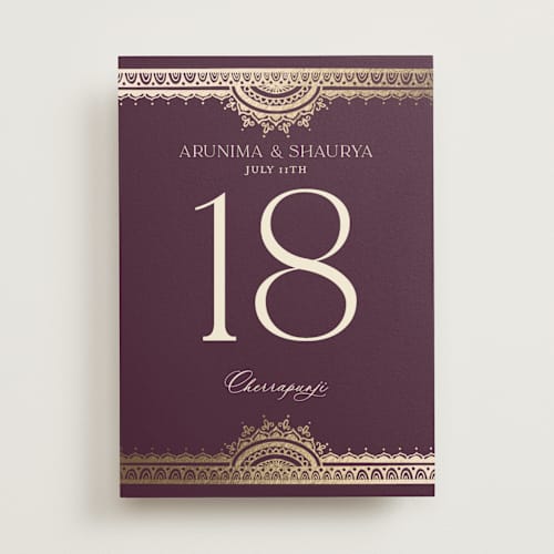 This is a plum table numbers with foil pressed by Randi Cirelli called arunima printing on doublethick in standard