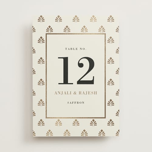 This is a champagne table numbers with foil pressed by Oma N. Ramkhelawan called henna stamp printing on doublethick in standard