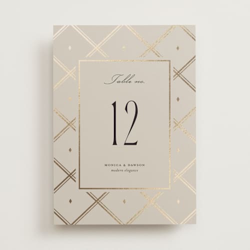 This is a champagne table numbers with foil pressed by Kristin Oliversen called luxe lines printing on doublethick in standard