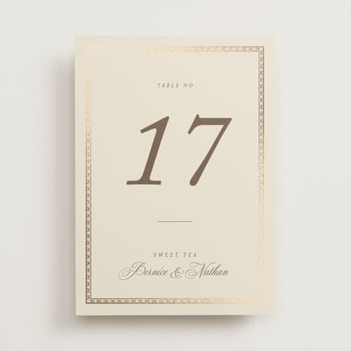 This is a champagne table numbers with foil pressed by Deynaaz Daraei called ahlum printing on doublethick in standard