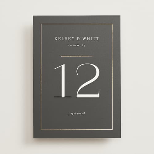 This is a stormy table numbers with foil pressed by Jessica Williams called over monogram printing on doublethick in standard