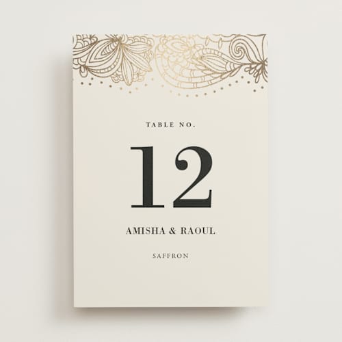 This is a champagne table numbers with foil pressed by Oma N. Ramkhelawan called elegant henna printing on doublethick in standard