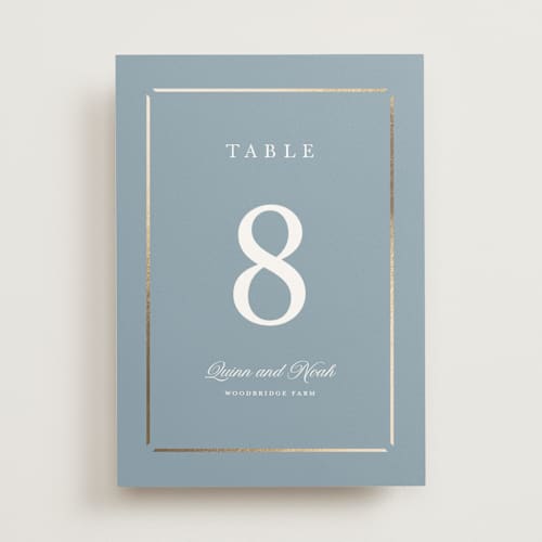 This is a dusty blue table numbers with foil pressed by Stacey Meacham called elegant bevel printing on doublethick in standard