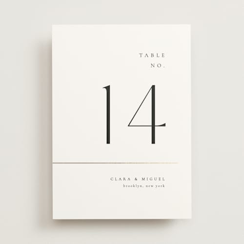 This is a silk table numbers with foil pressed by Kelly Schmidt called golden ampersand printing on doublethick in standard