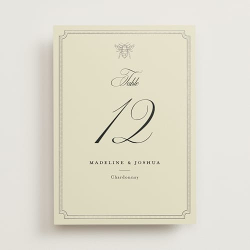 This is a cream table numbers with foil pressed by Jennifer Lew called honeybee printing on doublethick in standard