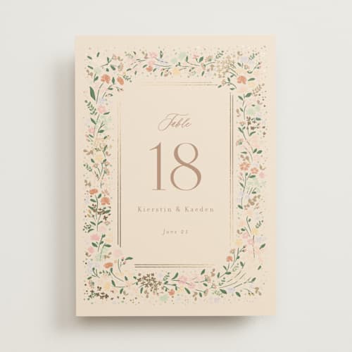 This is a ivory table numbers with foil pressed by Jennifer Wick called esther's garden printing on doublethick in standard