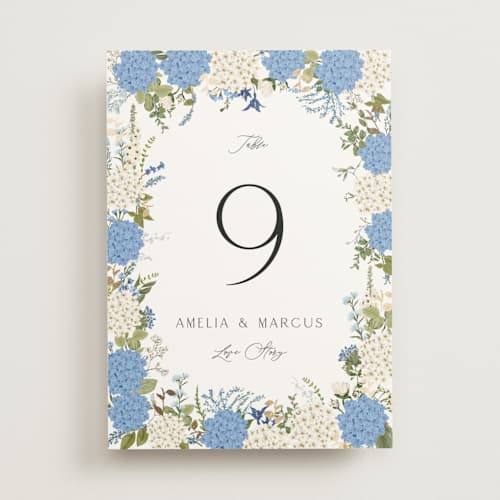 This is a coastal table numbers with foil pressed by Susan Moyal called garden whisper printing on doublethick in standard