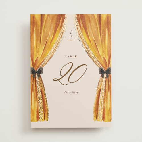 This is a golden table numbers with foil pressed by Claudia Orengo called tuileries printing on doublethick in standard