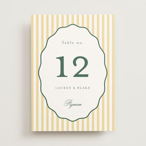 This is a citrine table numbers with standard by Emily Betts called curved frame printing on doublethick in standard