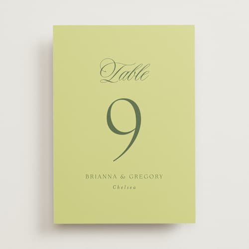 This is a chartreuse table numbers with standard by Everett Paper Goods called carlyle printing on doublethick in standard