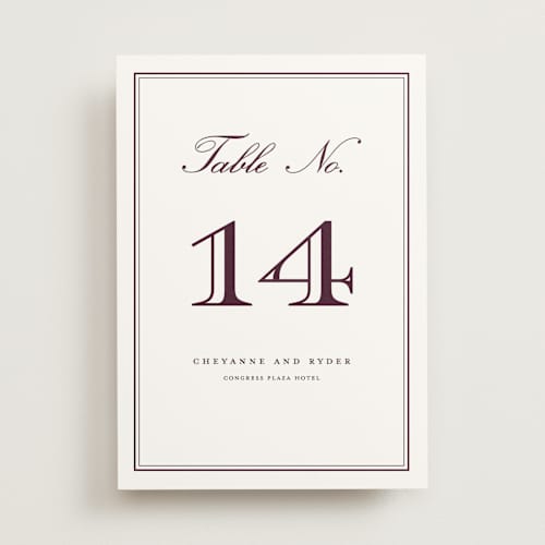 This is a burgundy table numbers with standard by Stacey Meacham called engraved names printing on doublethick in standard
