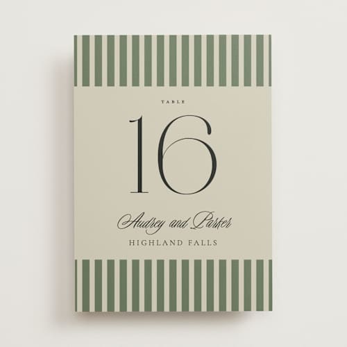 This is a ruby table numbers with standard by Jackie Crawford called holiday ribbon printing on doublethick in standard