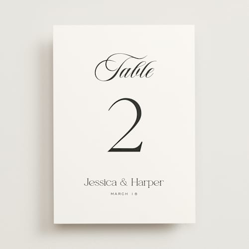 This is a obsidian table numbers with standard by Jennifer Postorino called modern romance printing on doublethick in standard