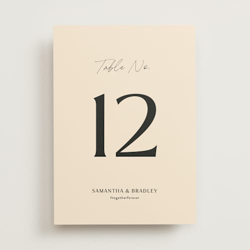 This is a champagne table numbers with standard by Wallace Design Co. called french whimsy script printing on doublethick in standard