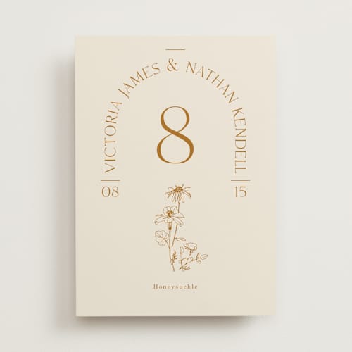 This is a cream table numbers with standard by Baumbirdy called floral type arch printing on signature in standard