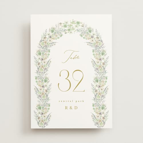 This is a greenery table numbers with standard by Phrosné Barwood called floral arch printing on doublethick in standard