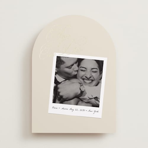 This is a linen foil stamped save the date cards with foil pressed by Lori Wemple called polaroid script printing on recycled smooth signature in standard