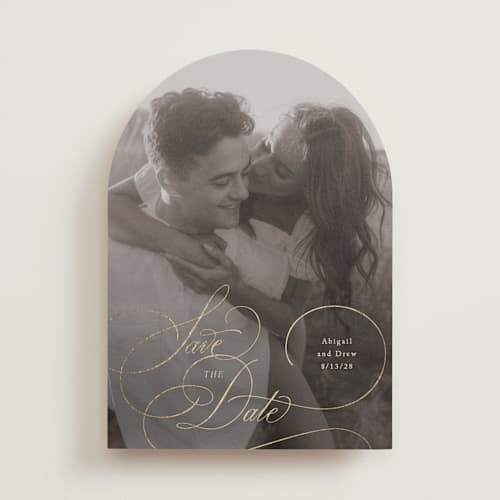 This is a cream foil stamped save the date cards with foil pressed by Hooray Creative called elegantly scripted printing on recycled smooth signature in standard