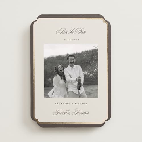 This is a cognac foil stamped save the date cards with foil pressed by Emily Betts called arch frame printing on recycled smooth signature in standard