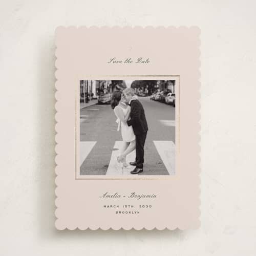 This is a champagne foil stamped save the date cards with foil pressed by Paper Raven Co. called little heart printing on recycled smooth signature in standard