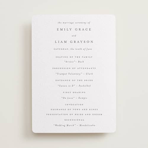This is a soft black unique wedding programs with letterpress by Design Lotus called a thousand years printing on white cotton in standard