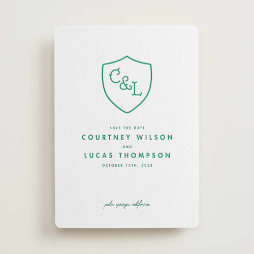 This is a emerald save the date with letterpress by mo kelley called simple crest printing on white cotton in standard