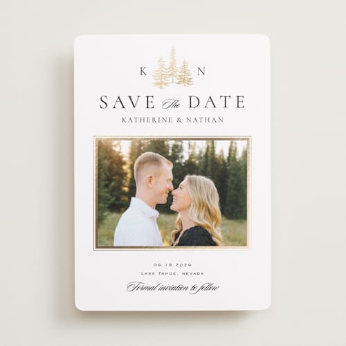 This is a snow foil stamped save the date cards with foil pressed by Stacy Maalouf called gilded forest printing on recycled smooth signature in standard