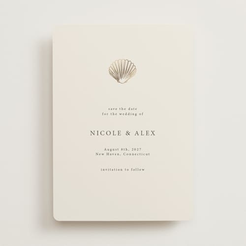 This is a sand foil stamped save the date cards with foil pressed by Hannah Bowman called simple seashell printing on signature in 5x7