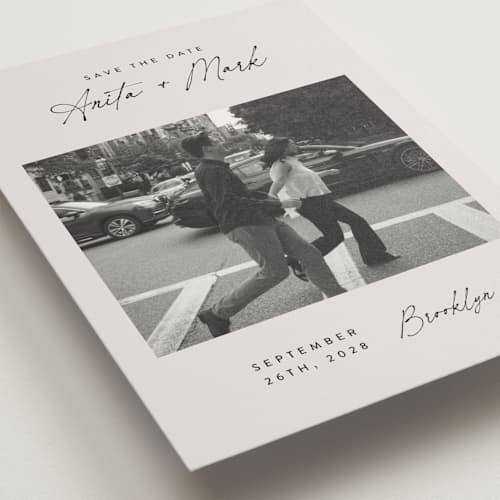 This is a eggshell save the date with standard by Paper Raven Co. called moment in time printing on recycled smooth signature in grand