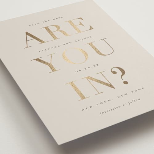 This is a taupe foil stamped save the date cards with foil pressed by Sara Hicks Malone called are you in? printing on signature in grand