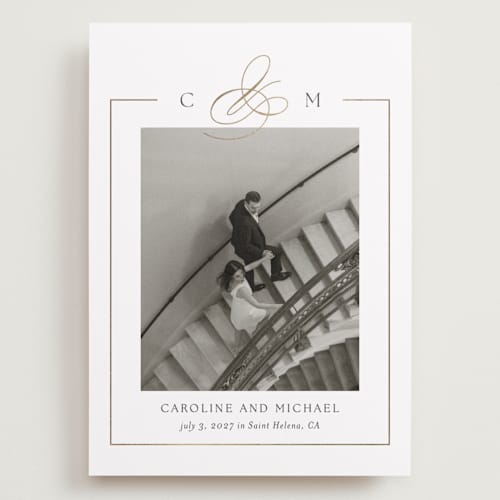 This is a silk foil stamped save the date cards with foil pressed by Kelly Schmidt called framed monogram printing on recycled smooth signature in grand