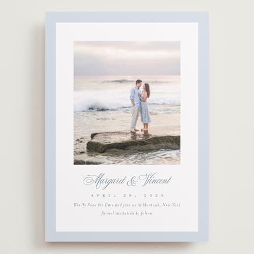 This is a dusty blue save the date with standard by Jennifer Postorino called coastal charm printing on recycled smooth signature in grand