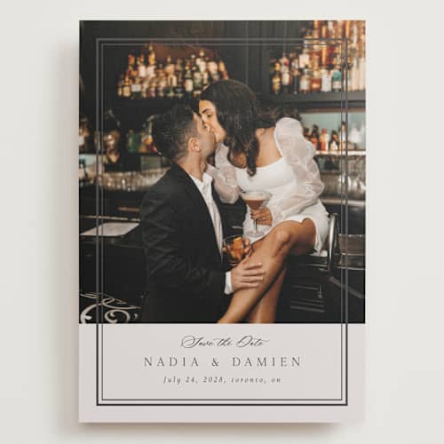 This is a linen save the date with standard by Nicole Walsh called shimmer printing on recycled smooth signature in grand