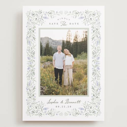This is a periwinkle save the date with standard by Kristen Smith called delicate vines printing on recycled smooth signature in grand