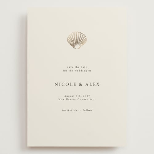 This is a sand foil stamped save the date cards with foil pressed by Hannah Bowman called simple seashell printing on signature in grand