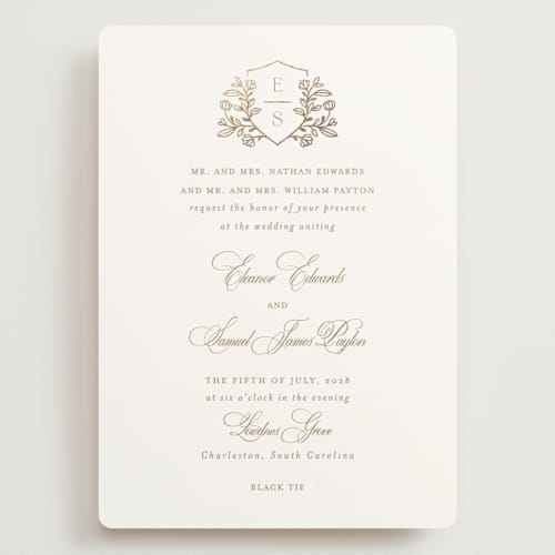 This is a ivory wedding invitations with foil pressed by Mansi Verma called gold crest printing on signature in grand