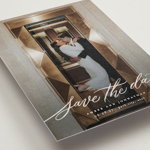 This is a chamomile save the date postcards with standard by Wildfield Paper Co called daisy printing on signature in postcard