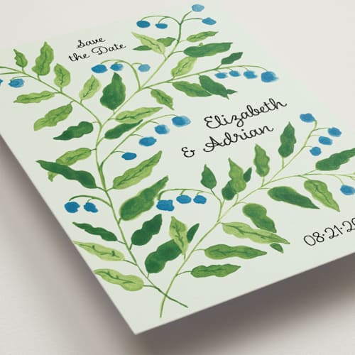 This is a mint save the date postcards with standard by Studio Suku called lily of the valley printing on signature in postcard